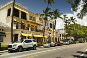 Naples, Florida - June 14, 2019:  Tourist walk and shop along the restaurants and luxury stores of 5th Avenue in downtown Naples Florida USA